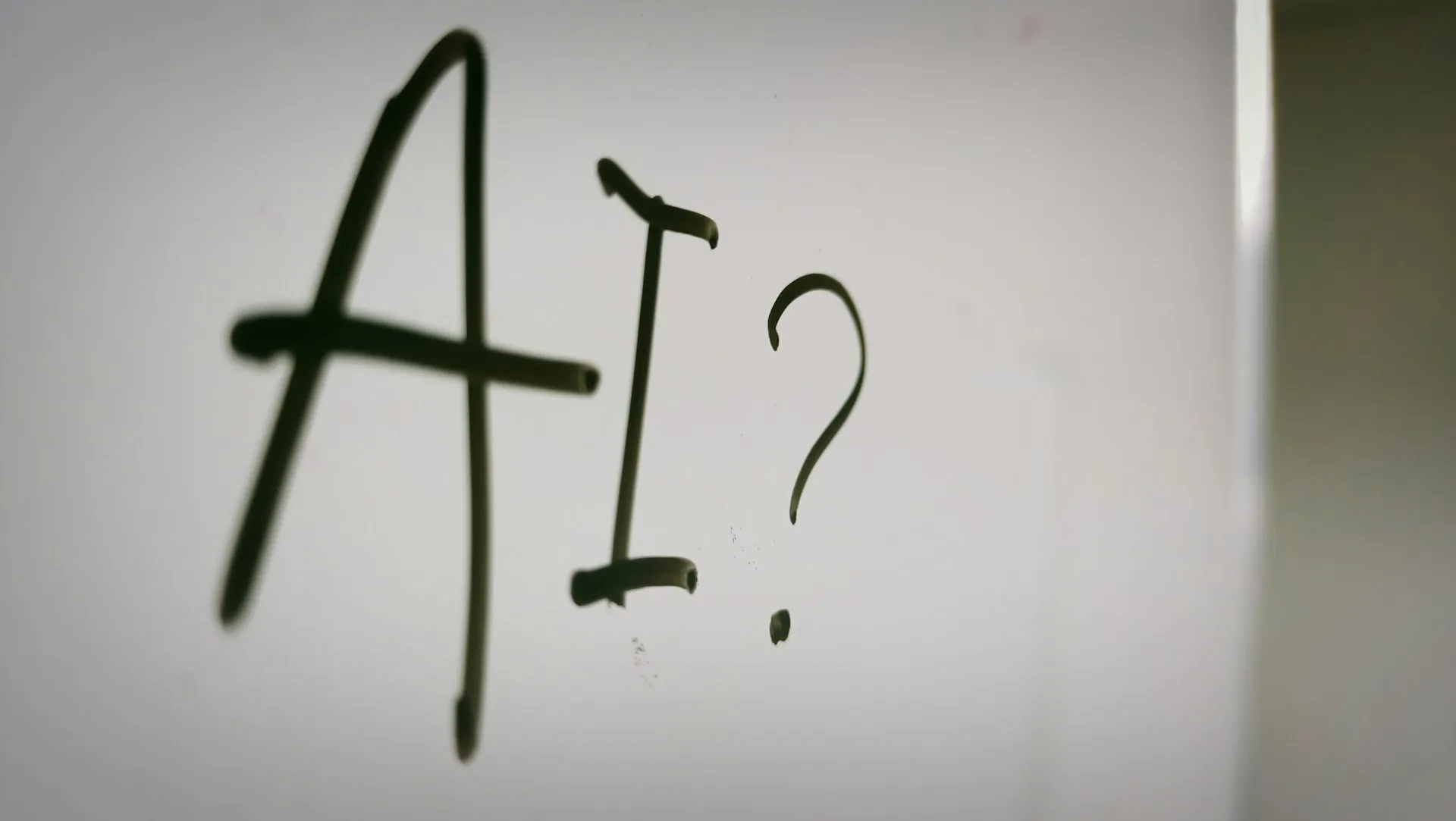 Illustration with 'AI' written on a white board, with a question mark